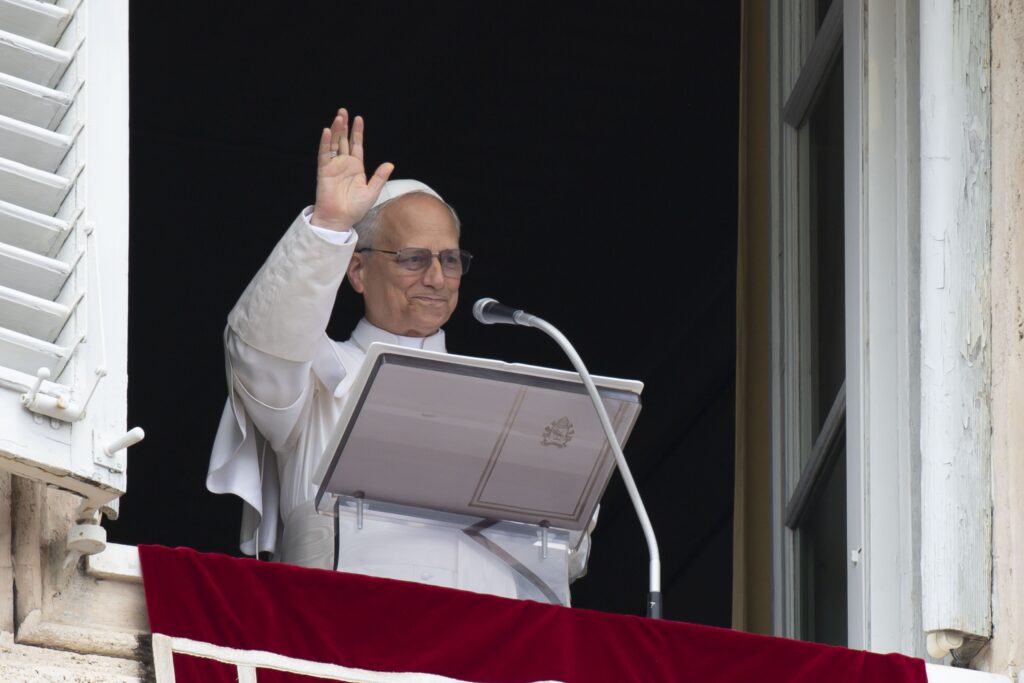 Pope Leo XIV waves to the crowd in St. Peter's Square at the Vatican as they join him for the recitation of the Angelus prayer and an appeal for peace hours after the U.S. bombed nuclear enrichment facilities in Iran June 22, 2025.