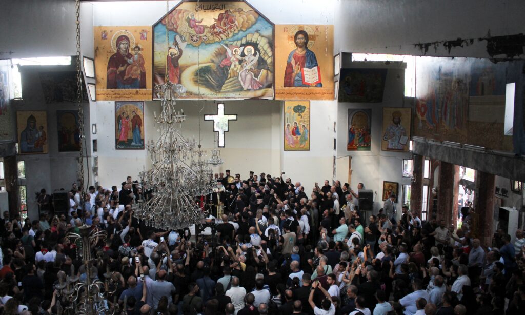People attend a Mass inside Mar Elias Church in the Dweil'a neighborhood of Damascus, Syria, on June 23, 2025, following a June 22 suicide bombing at the church.