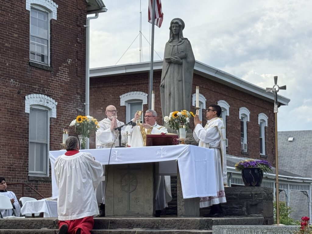 Archdiocese of New York Auxiliary Bishop Gerardo J. Colacicco (center) celebrates Mass at the Our Lady of the Hudson Shrine in Port Ewen.