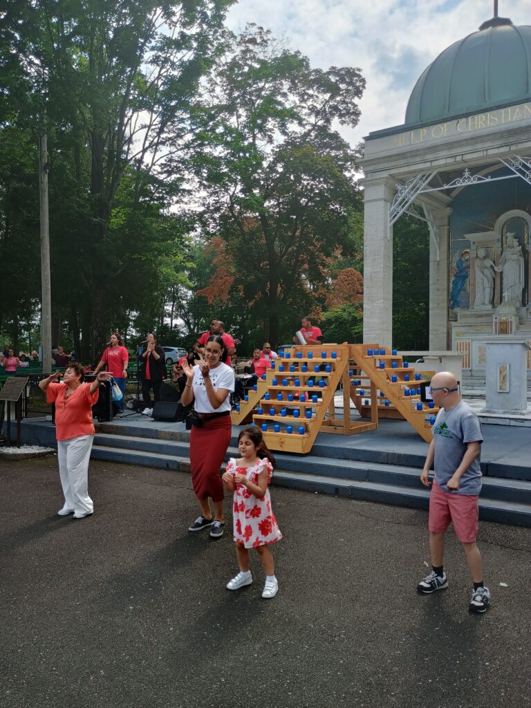 People sing and dance for the Lord during the Pentecost Festival in Stony Point, June 8, 2025, led by the music group Santos and the Band.