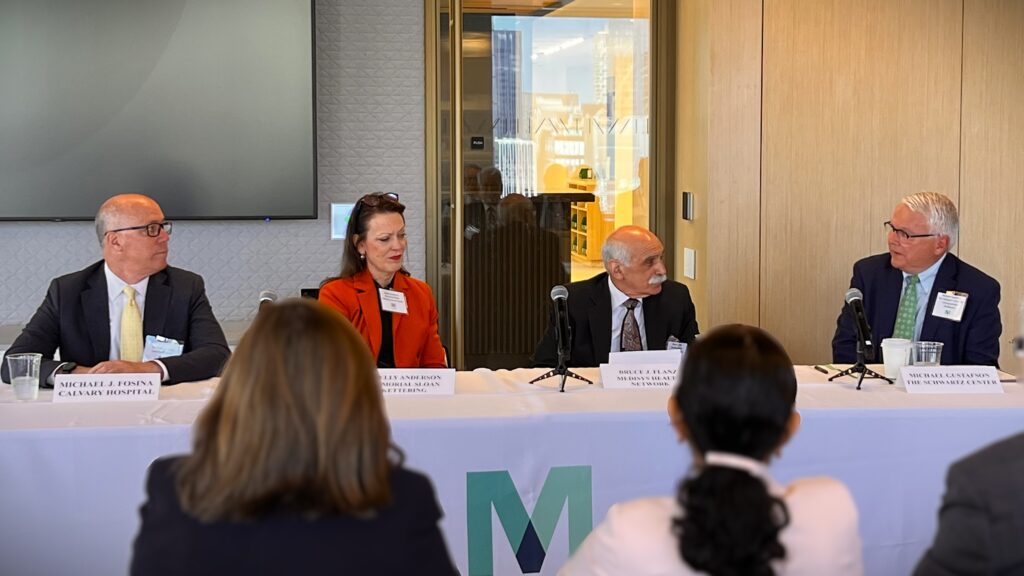 Michael J. Fosina, president, Calvary Hospital; Shelly Anderson, Memorial Sloan Kettering Cancer Center president; Bruce J. Flanz, president and CEO of MediSys Health Network; and Dr. Michael Gustafson, Chief Executive Officer, The Schwartz Center, discuss compassionate care and the emotional well-being of healthcare professionals during a panel discussion in Midtown Manhattan.