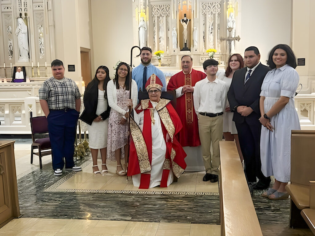 Mount Saint Mary College students who received sacraments pose with Most Rev. Dominick J. Lagonegro.