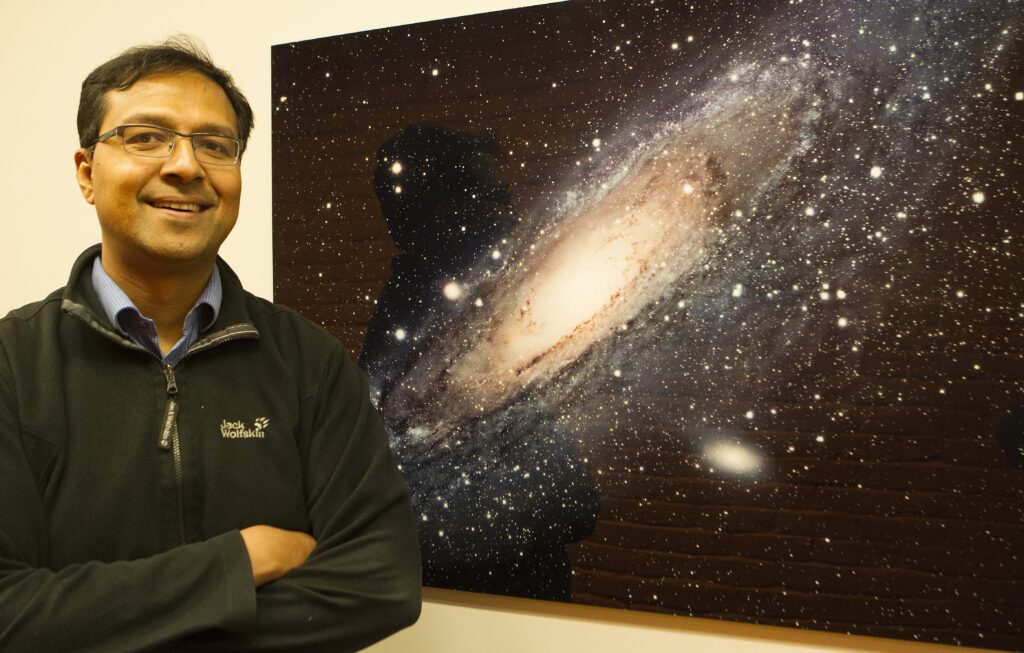 Jesuit Father Richard D'Souza, pictured in a May 8, 2019, photo, in Ann Arbor, Michigan, studies the structure of stellar halos around galaxies.