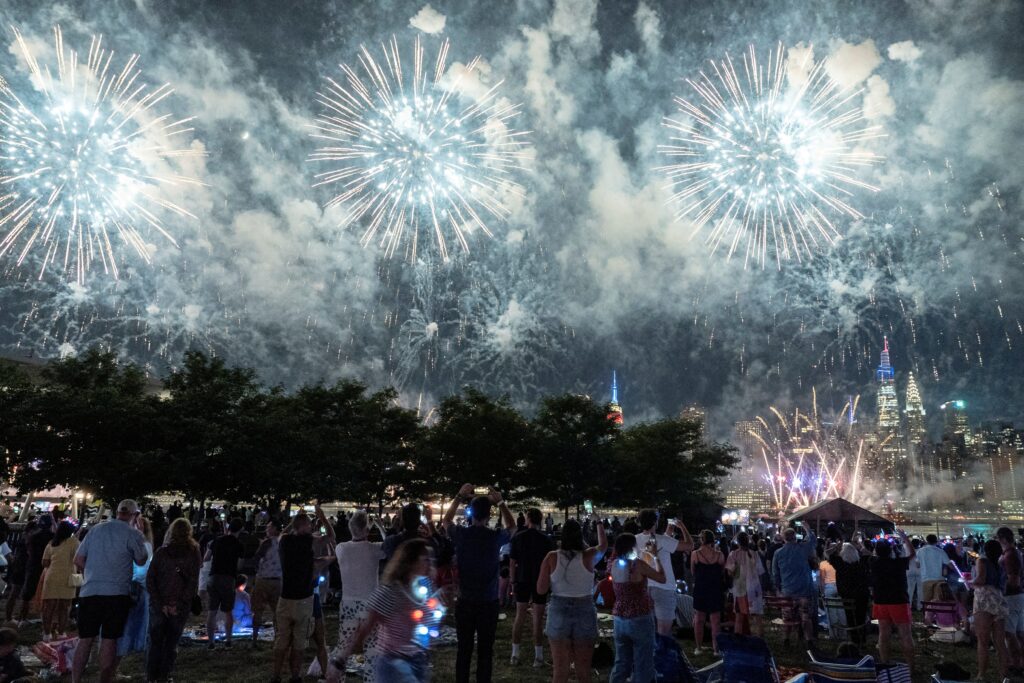 People watch the Macy's Fourth of July fireworks in New York City on July 4, 2022.