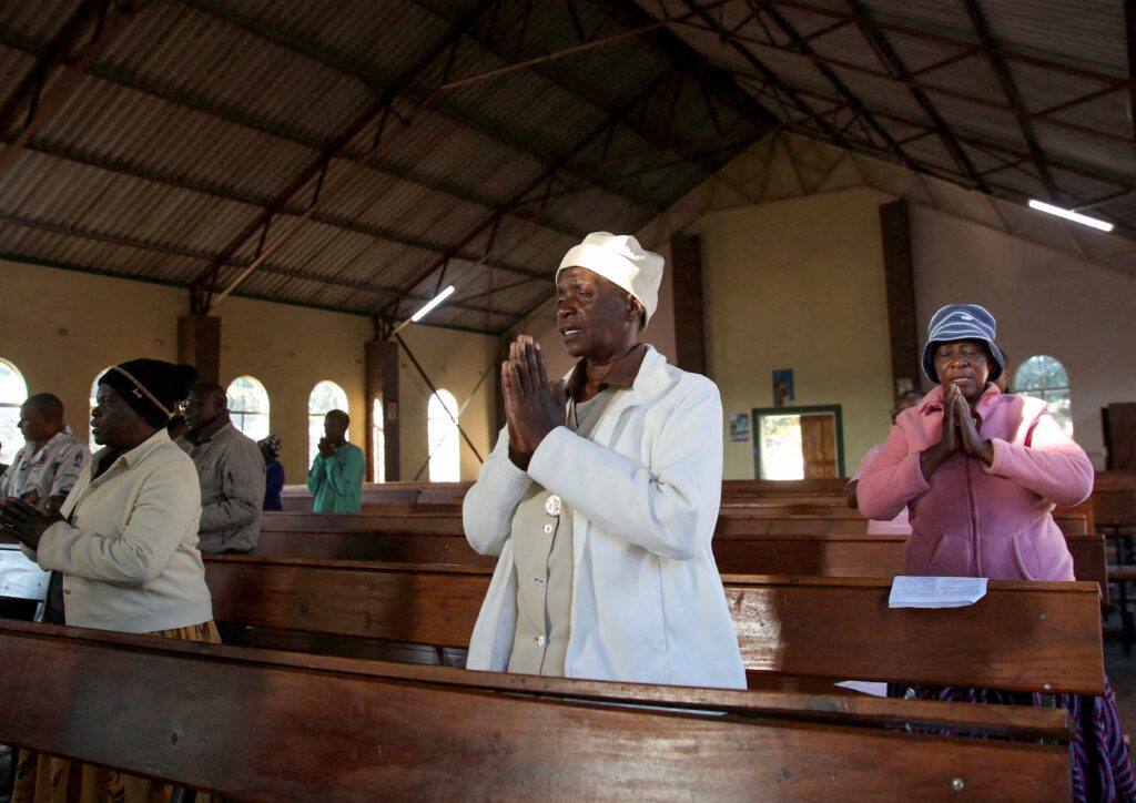 Women pray during a Mass in Marondera, Zimbabwe, April 22, 2025, following the death of Pope Francis.