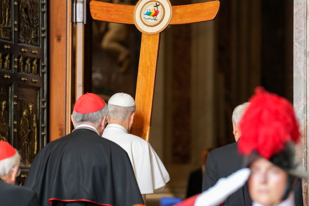 Carrying the Jubilee cross, Pope Leo XIV leads a procession of members of the Roman Curia through the Holy Door of St. Peter’s Basilica during the Jubilee of the Holy See at the Vatican, June 9, 2025.