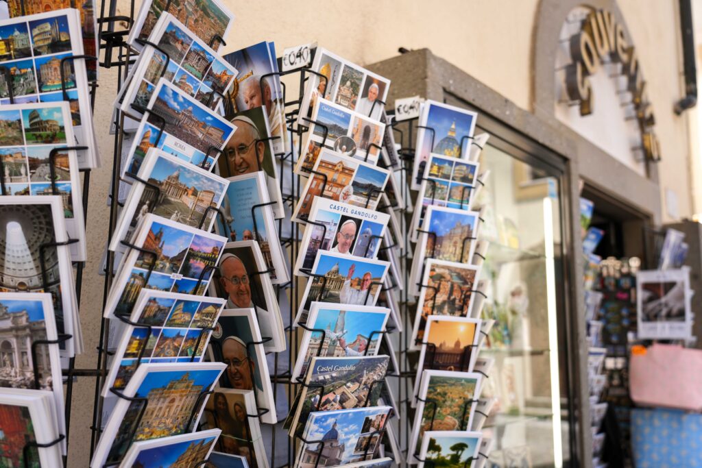 Postcards featuring images of Pope Francis are displayed for sale outside a souvenir shop in Castel Gandolfo, Italy, July 1, 2025, as the small town prepared for Pope Leo XIV’s first official visit for his customary July retreat.
