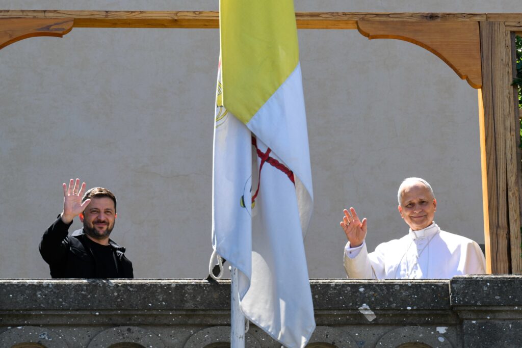 Pope Leo XIV and Ukrainian President Volodymyr Zelenskyy wave from the papal villa in Castel Gandolfo, Italy, during their meeting on July 9, 2025.