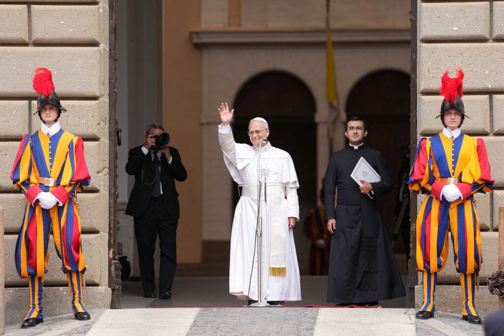 Pope Leo XIV greets people as he arrives to deliver his first Angelus from Castel Gandolfo, Italy, on July 13, 2025.