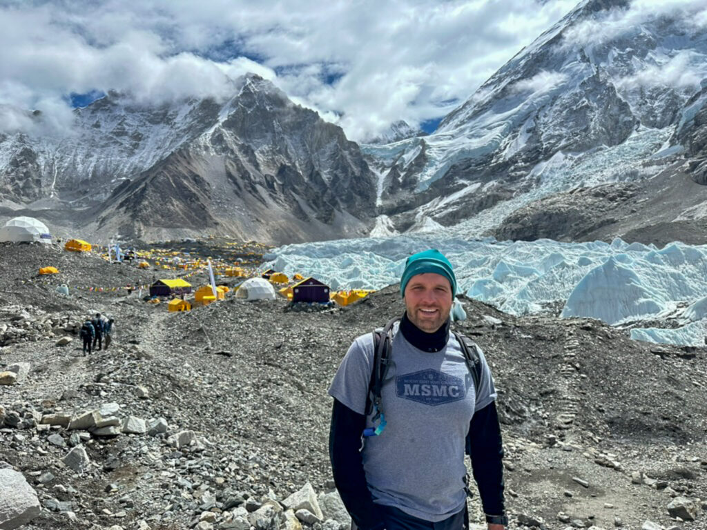 Casey Hintz, director of recruitment and training of Mount Saint Mary College's office of admissions, stands at Mount Everest base camp in Nepal in May 2025.