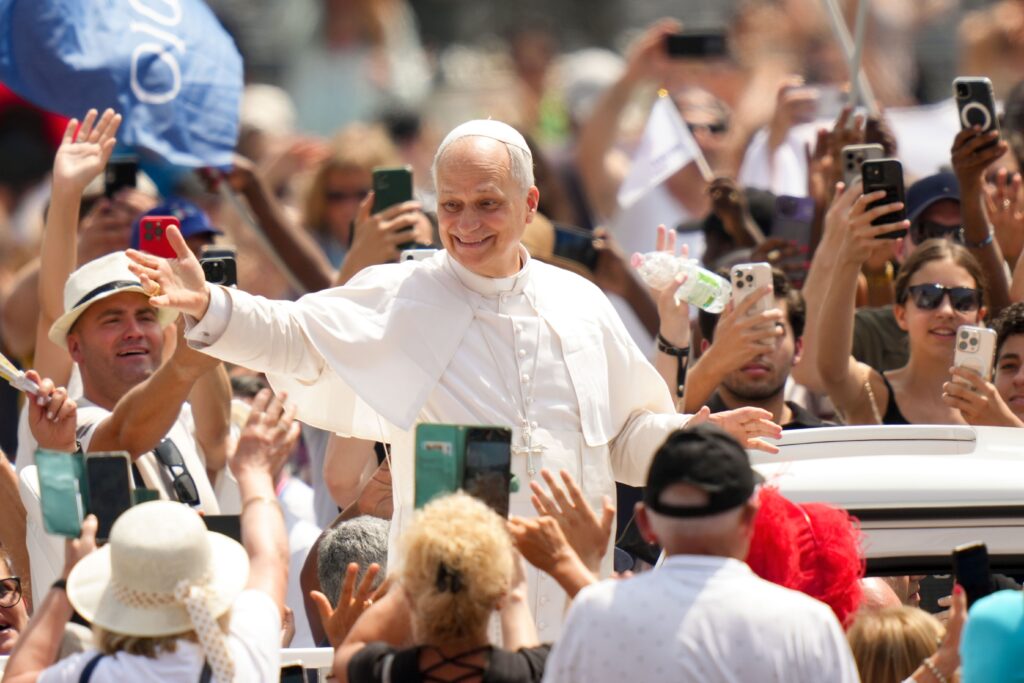 Pope Leo XIV greets people as he rides in the popemobile in St. Peter’s Square after celebrating Mass for the conclusion of the Jubilee of Sport in St. Peter’s Basilica at the Vatican on June 15, 2025.