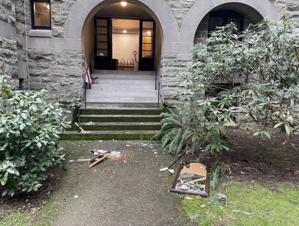 Broken glass and objects are seen on the ground on February 28, 2024, outside the historic Grotto, the National Sanctuary of Our Sorrowful Mother, in Portland, Oregon, after it sustained major damage in a vandalism attack.