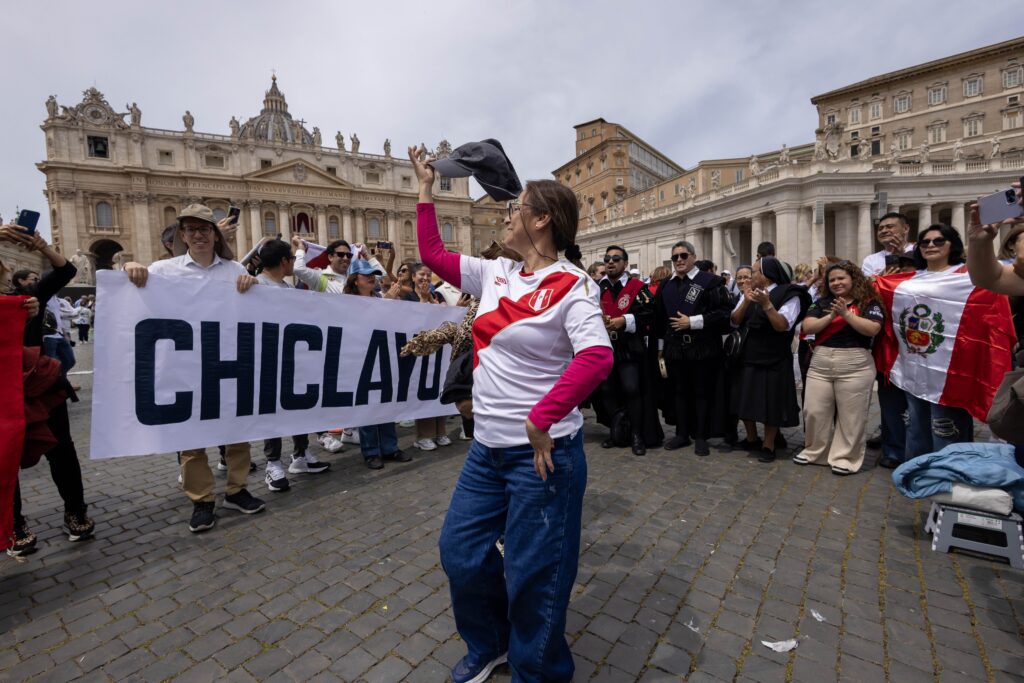 People from Peru hold up a banner saying Chiclayo, the diocese in Peru where the new Pope Leo XIV served as bishop from 2015 to 2023, as they join the pope for the "Regina Coeli" prayer in St. Peter's Square at the Vatican, May 11, 2025.