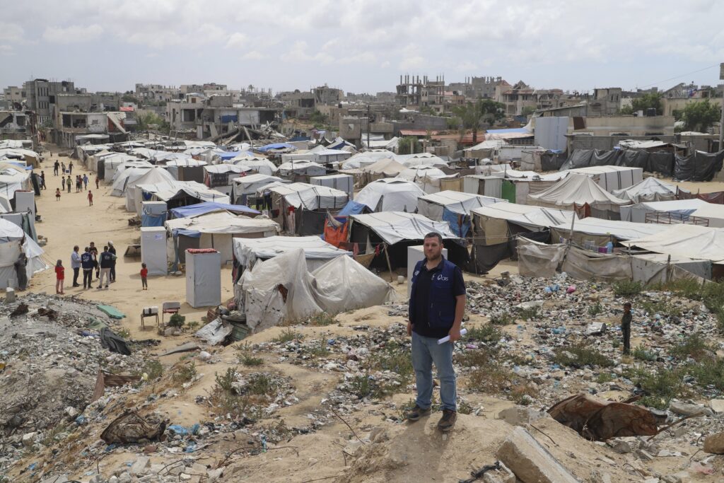 A Catholic Relief Services worker is pictured at a tent camp for displaced Palestinians in the Gaza Strip, May 5, 2025.