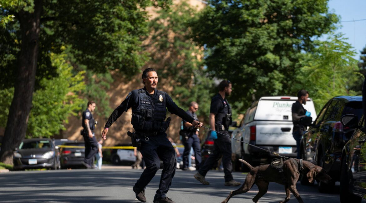 Police with a K9 unit sweep the neighborhood following a shooting on August. 27, 2025