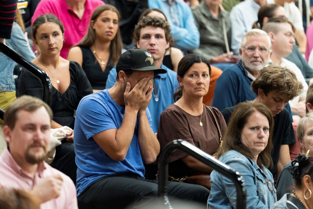 A man reacts during a prayer vigil at the Academy of Holy Angels following a shooting earlier in the day at Annunciation Church in Minneapolis August 27, 2025.