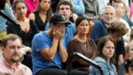 A man reacts during a prayer vigil at the Academy of Holy Angels following a shooting earlier in the day at Annunciation Church in Minneapolis August 27, 2025.