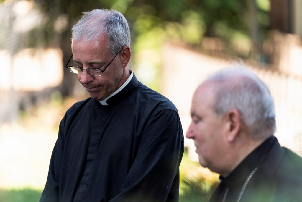 Father Dennis Zehren, pastor of Annunciation Church in Minneapolis, becomes emotional as he speaks to the media alongside Archbishop Bernard A. Hebda on August 30, 2025, about the recent shooting at the elementary school attached to the church.