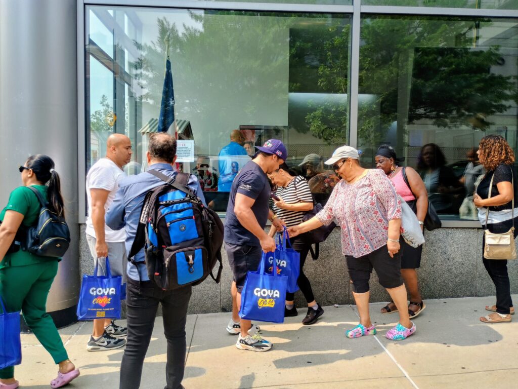 Volunteers helped in the distribution of food at the Alianza Dominicana Cultural Center in the Washington Heights area of Manhattan, hosted by Catholic Charities Community Services of New York, on Tuesday, August 5, 2025.