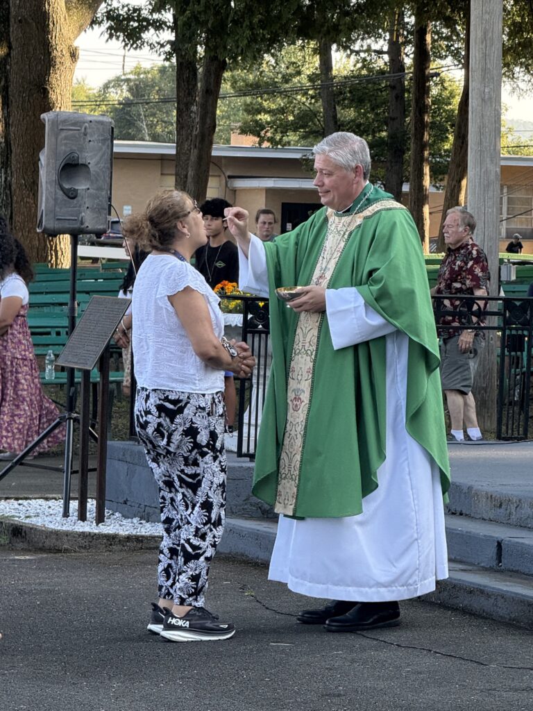 Archdiocese of New York Auxiliary Bishop John S. Bonnici distributes communion at the closing Mass of the Rise Up Festival at the Mary, Help of Christians National Shrine in Stony Point, on August 9, 2025.