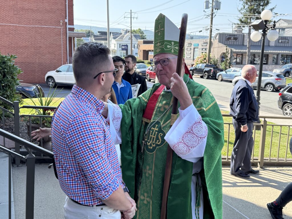 Cardinal Timothy Dolan greets a parishioner of Immaculate Conception in Port Jervis on August 10, 2025.