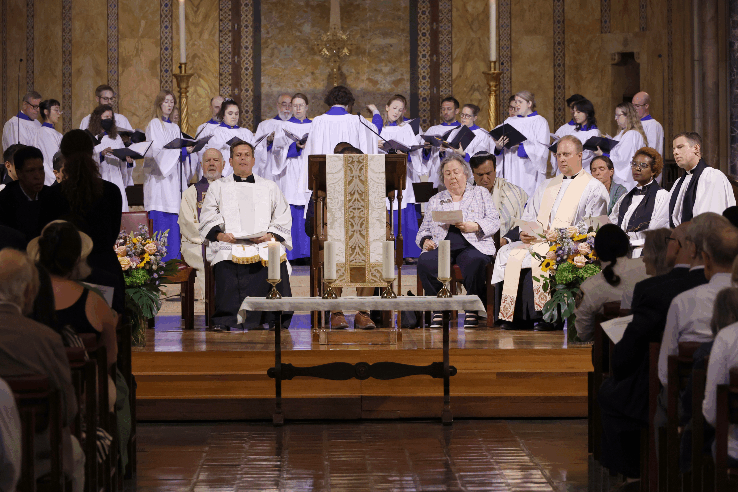 Alexander Pattavina, Associate Choirmaster of St. Bartholomew’s, leads the choir as the memorial candles are lit.