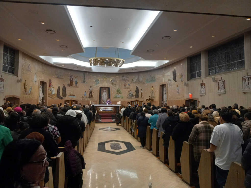 Archdiocese of New York Auxiliary Bishop Edmund J. Whalen (center, in purple) celebrates Mass during a Night of Hope retreat at the St. Frances Cabrini Shrine in Manhattan, March 2025.