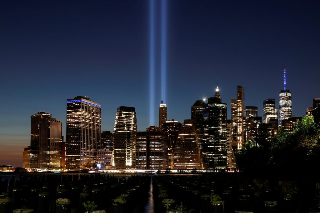 The Tribute in Light installation and the One World Trade Center tower are seen from Brooklyn Bridge Park in New York City on September 11, 2021.