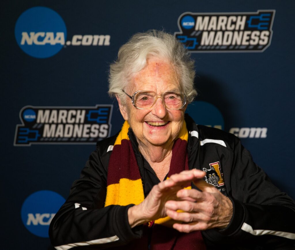 Sister Jean Dolores Schmidt, longtime chaplain of the Loyola University Chicago men's basketball team and campus icon, smiles after the team won in the first round game of the NCAA Tournament against the University of Miami in 2018 at the American Airlines Center in Dallas.