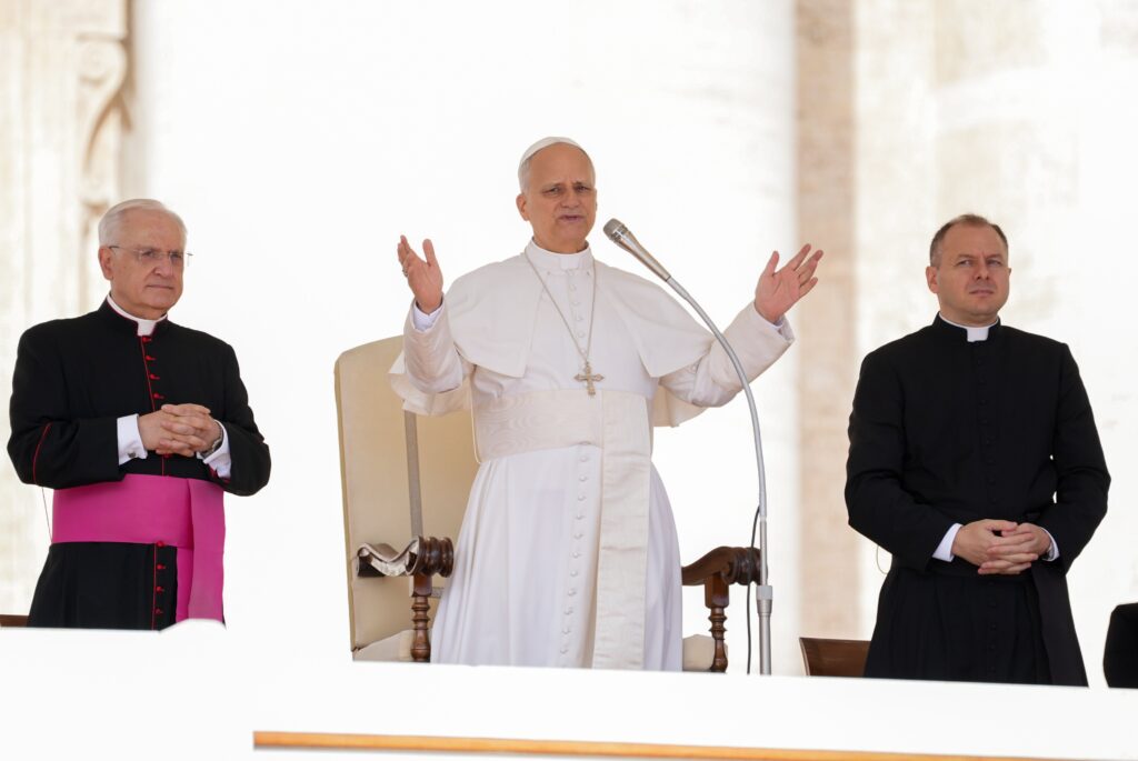 Pope Leo XIV greets visitors and pilgrims as he arrives in St. Peter's Square at the Vatican for his weekly general audience on September 3, 2025.