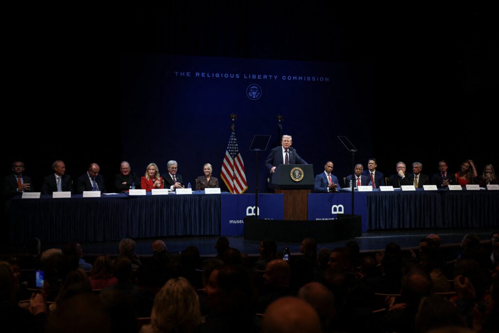 U.S. President Donald Trump delivers remarks to the Department of Justice's Religious Liberty Commission at the Museum of the Bible in Washington, September 8, 2025. Cardinal Timothy Dolan is fourth from left.