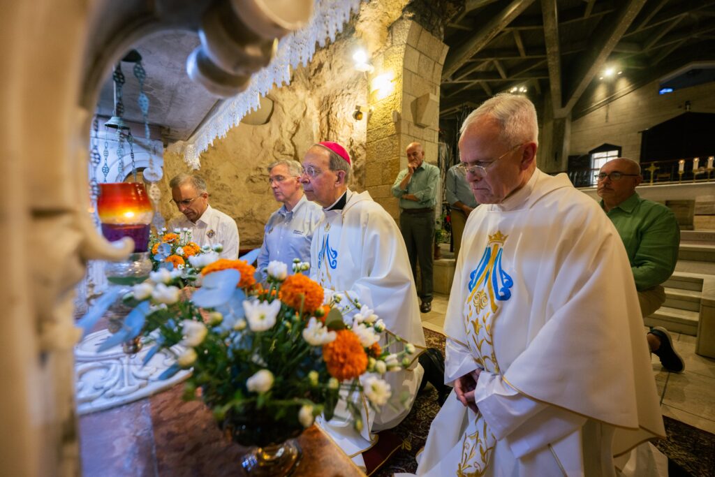 Monsignor Peter I. Vaccari (right), president of Catholic Near East Welfare Association, Supreme Secretary John Marrella (far left), Supreme Knight Patrick E. Kelly of the Knights of Columbus (second left), and Archbishop William E. Lori of Baltimore (second right), vice president of the U.S. Conference of Catholic Bishops, pray September 5, 2025, at the Basilica of the Annunciation in Nazareth, Israel, during their pastoral visit to the Holy Land, September 2-6.