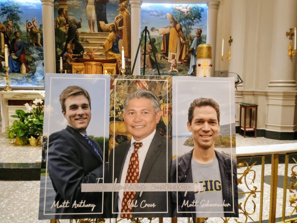 Pictures of Matt Anthony, Valentino Creus, and Matt Schoenecker (L to R) are displayed at the front of the sanctuary of St. Agnes Church in Midtown Manhattan before the start of a memorial Mass for them on September 10, 2025.