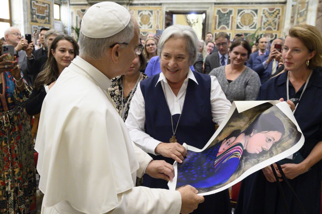 Pope Leo XIV receives a painting from Sister Norma Pimentel, an artist, a Missionary of Jesus and executive director of Catholic Charities of the Rio Grande Valley in Brownsville, Texas, during an audience at the Vatican October 2, 2025. Photo: CNS/Vatican Media