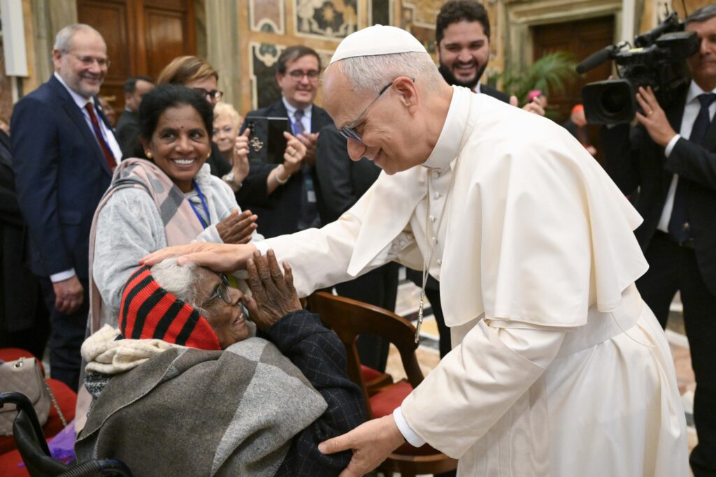 Pope Leo XIV greets a participant in an international conference on the pastoral care of the elderly organized by the Dicastery for Laity, the Family and Life at the Vatican, October 3, 2025.