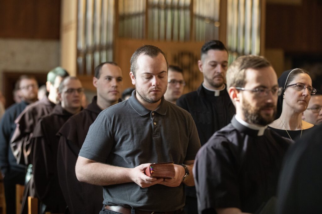 Aidan Hauersper, center, then-a seminarian of the Archdiocese of Indianapolis, prays Morning Prayer on May 4, 2023, in the St. Thomas Aquinas Chapel at St. Meinrad Seminary and School of Theology in St. Meinrad.