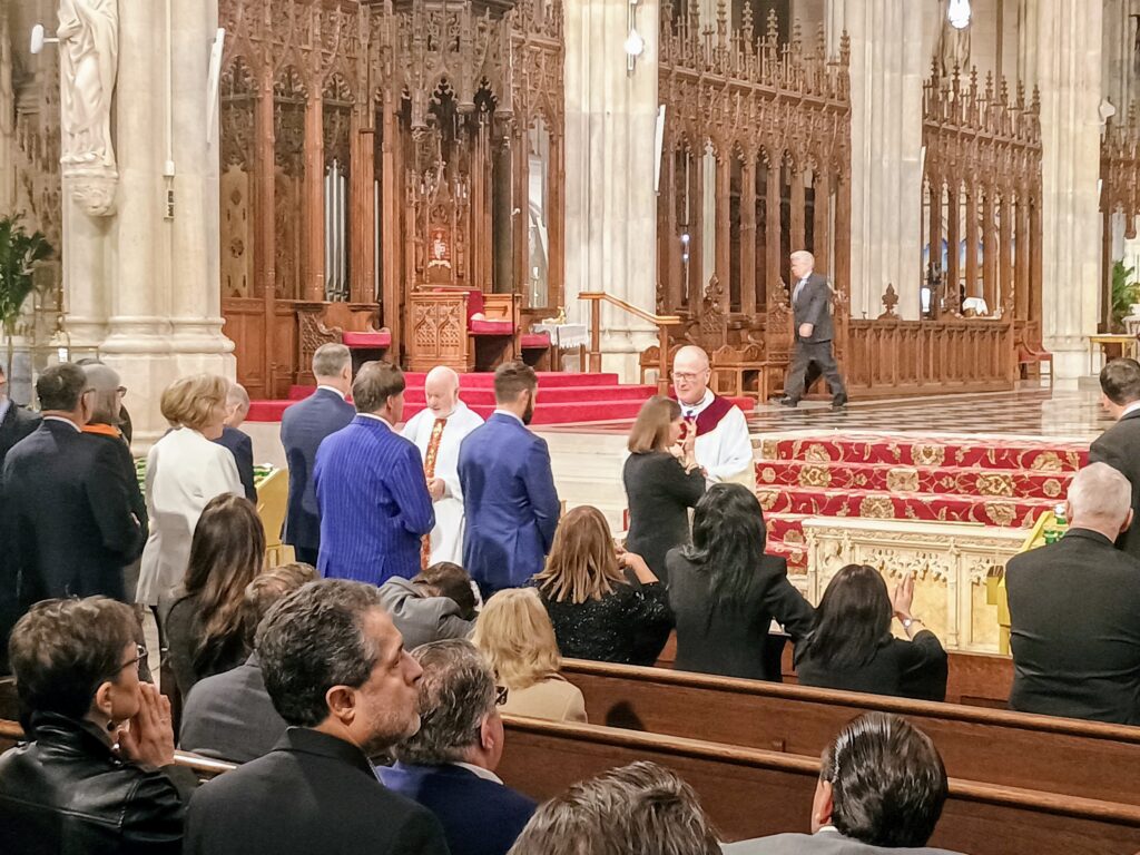 Cardinal Timothy Dolan and Monsignor Kevin Sullivan administer communion during a special Mass acknowledging the works of Catholic Charities New York and welcoming its new CEO, J. Antonio Fernandez, at St. Patrick's Cathedral, Wednesday, October 22, 2025.