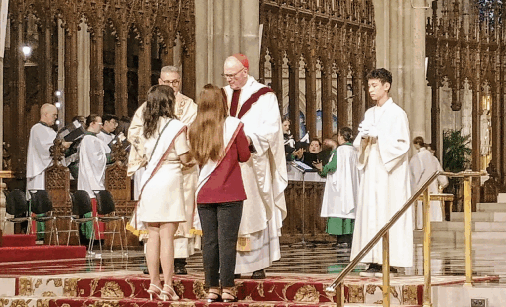 Cardinal Dolan received the communion offertory during the Columbus Day Mass at St. Patrick’s Cathedral, Monday, October 13, 2025.