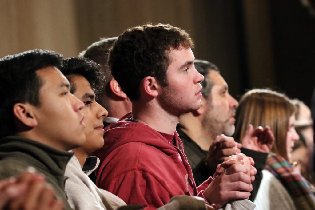 Young people are pictured in a file photo holding hands as they pray the Lord's Prayer during the opening Mass of the National Prayer Vigil for Life at the Basilica of the National Shrine of the Immaculate Conception in Washington.