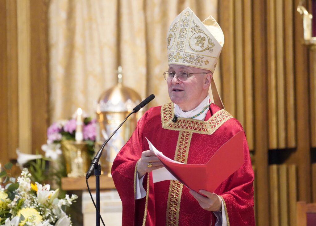 Auxiliary Bishop James Massa of Brooklyn addresses confirmation candidates during Mass on May 5, 2022, at Holy Family Church in Queens.
