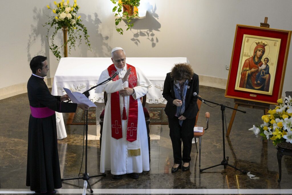Pope Leo XIV, flanked by his personal secretary and an interpreter, gives his blessing to the Little Sisters of the Poor and the elderly people they care for in Istanbul on November 28, 2025.