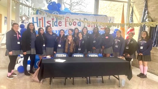 Students from Maria Regina High School raised more than $700 and donated it to Hillside Food Outreach.