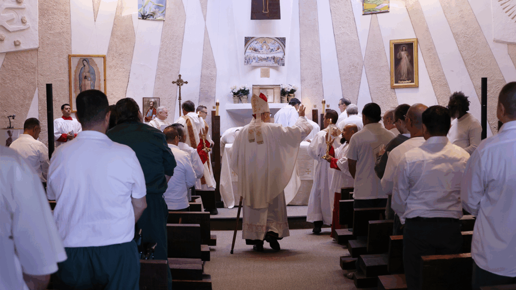 Cardinal Timothy Dolan (center) greets incarcerated men, prison administration, and staff during a visit to the Green Haven Correctional Facility on November 24, 2025.