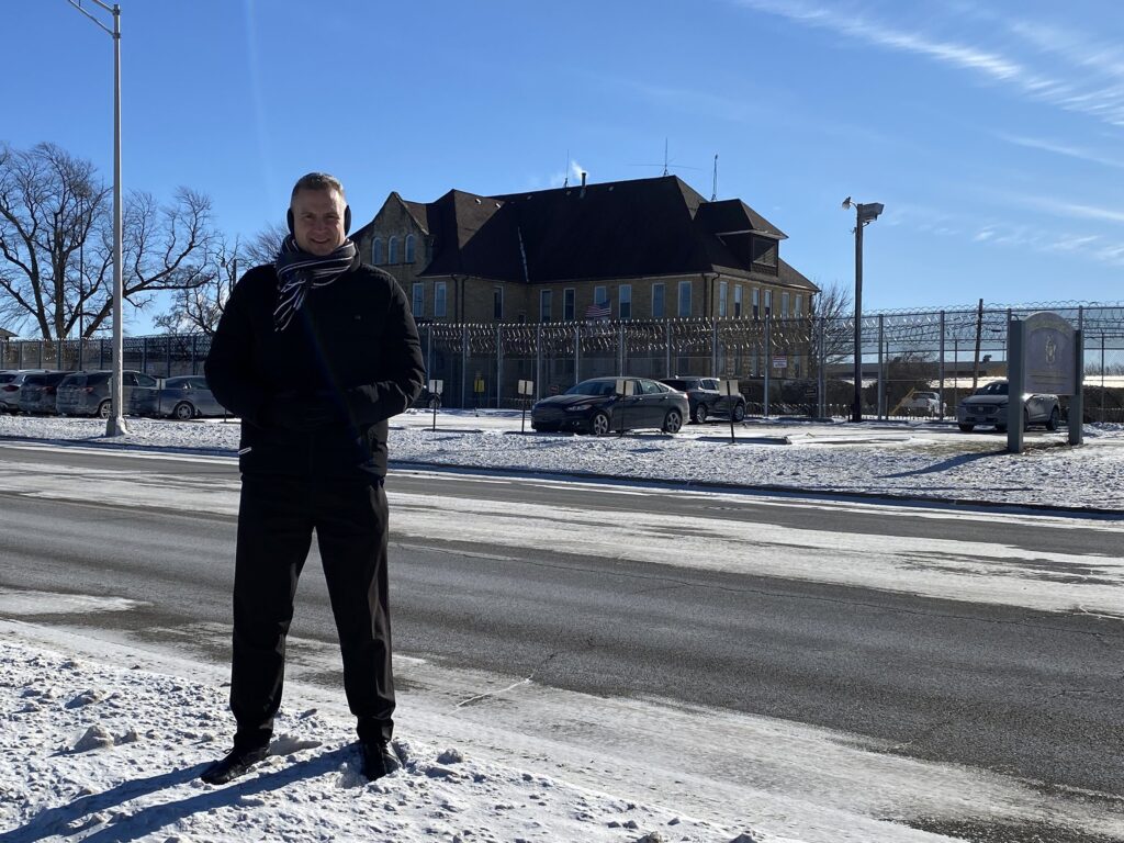 Bishop Ronald A. Hicks of Joliet, Illinois stands across the street from the Joliet Treatment Center, December 25, 2022, where he celebrated Christmas Mass for inmates.