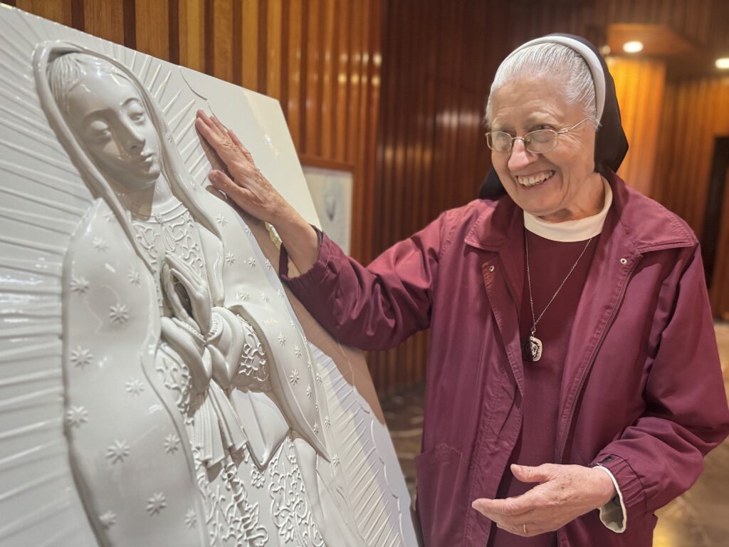 Sister María Celina Mota Campos moves toward a sculpture for the blind at the Basilica of Our Lady of Guadalupe in Mexico City on November 6, 2025.