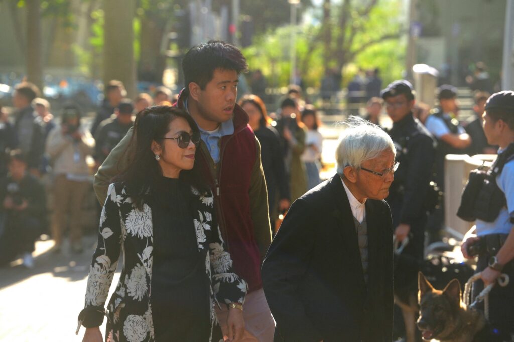 Jimmy Lai's wife, Teresa Lai, son Shun Yan and Cardinal Joseph Zen arrive at the West Kowloon Magistrates' Courts building in Hong Kong, China, on December 15, 2025, for the verdict in the trial of Jimmy Lai, a prominent Hong Kong Catholic, philanthropist, and media mogul.