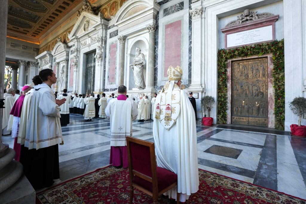 Cardinal James M. Harvey, archpriest of Rome's Basilica of St. Paul Outside the Walls stands in front of the basilica's Holy Door after solemnly closing it on December 28, 2025, as the Jubilee Year drew to a close.