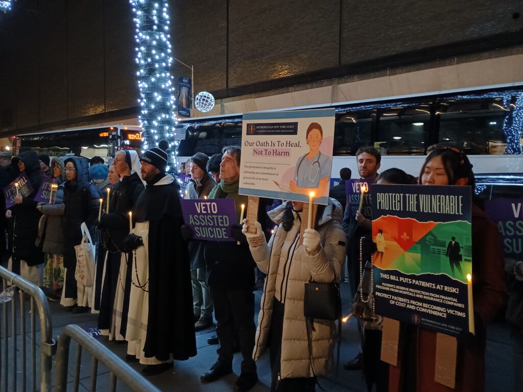 Several dozen protestors, including Sisters of Life, attend a candlelight vigil outside Governor Hochul’s Manhattan office on December 4, 2025.