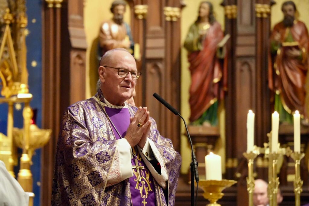 Cardinal Timothy Dolan is shown celebrating Mass at Old St. Patrick's Cathedral on November 1, 2025.