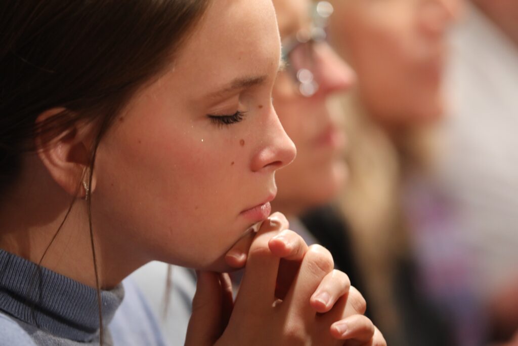 A young woman prays at the National Prayer Vigil for Life in Washington on January 19, 2023.